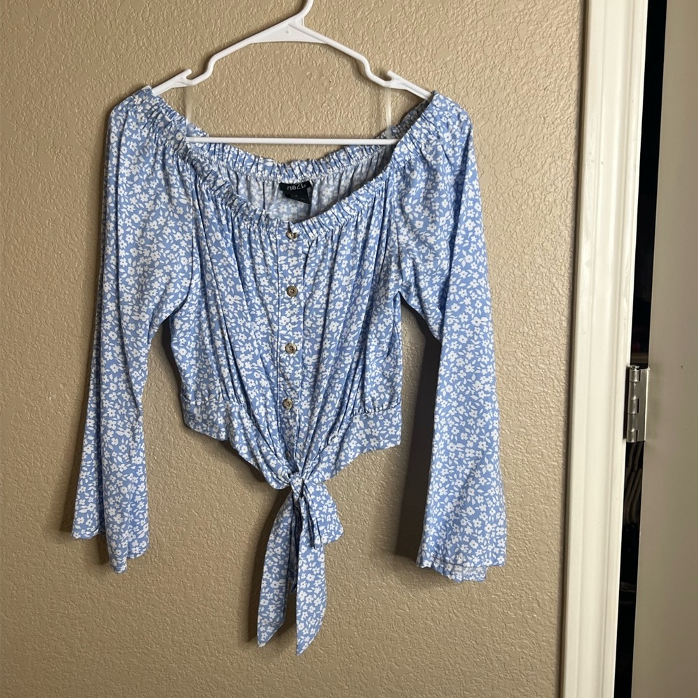 Copy style floral top, buttons down the middle, flare sleeves. New with tags.